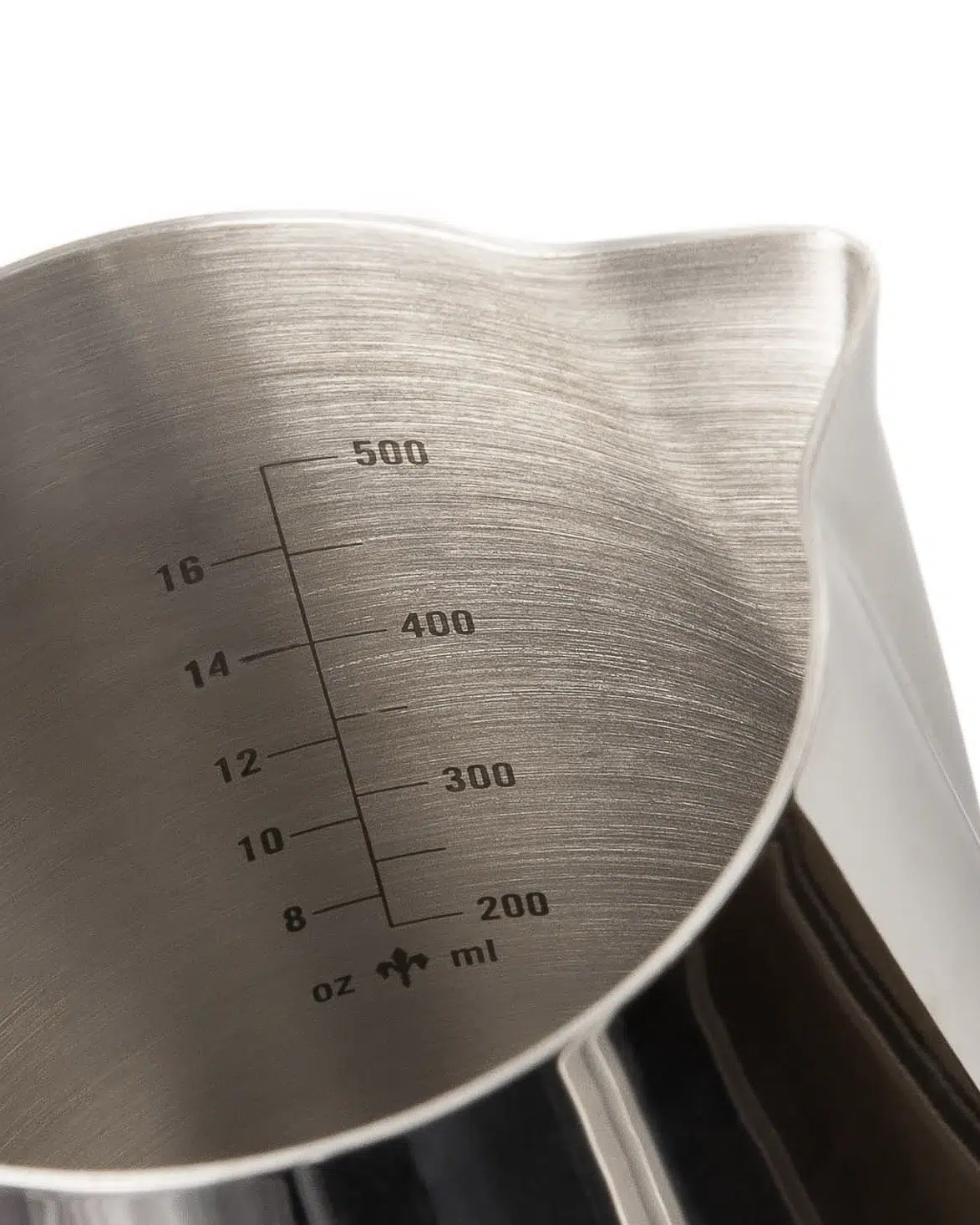 Volume markings inside a stainless steel La Marzocco milk pitcher