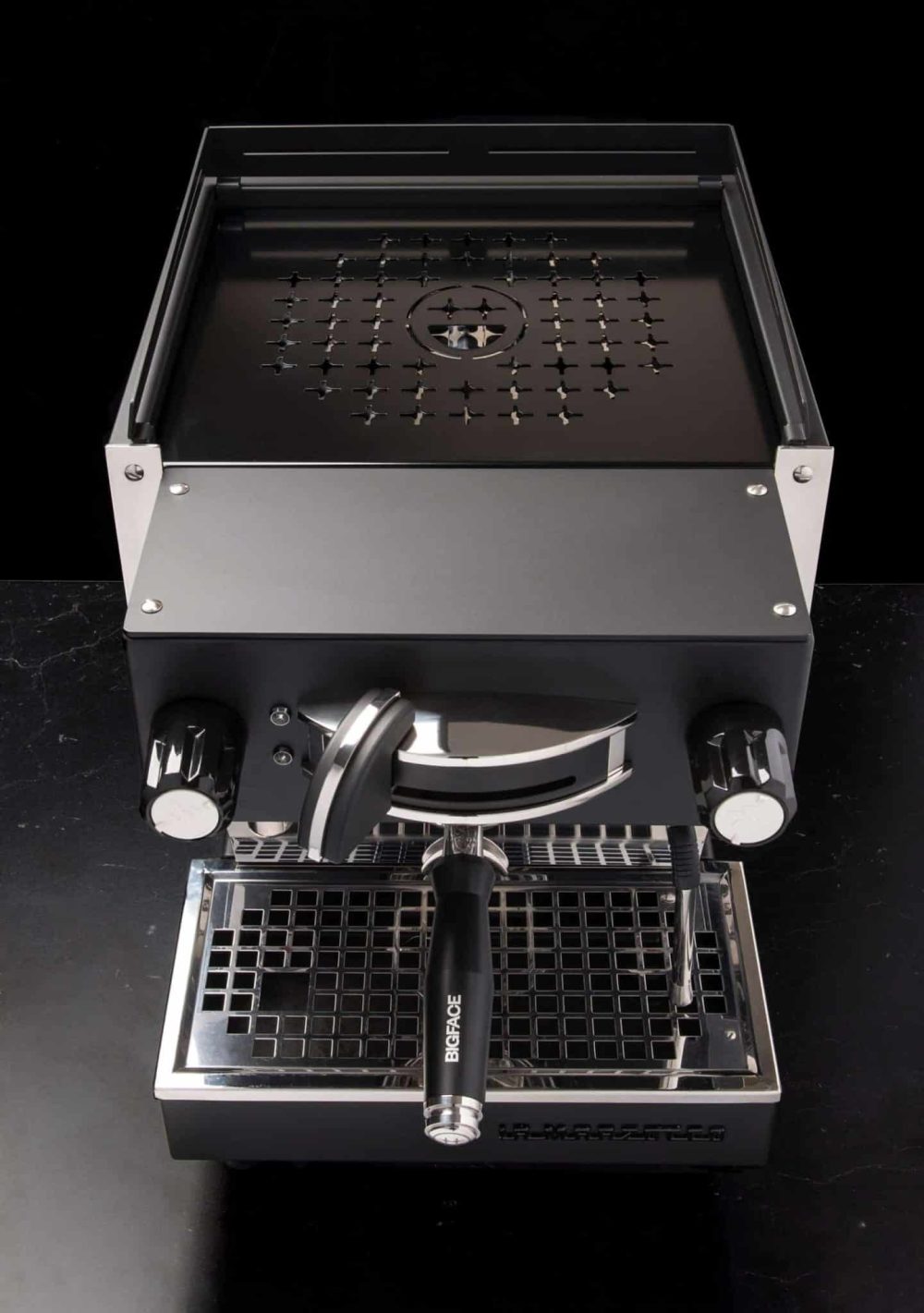 Star-perforated top tray and drip tray of the BIGFACE La Marzocco Linea Mini seen from above