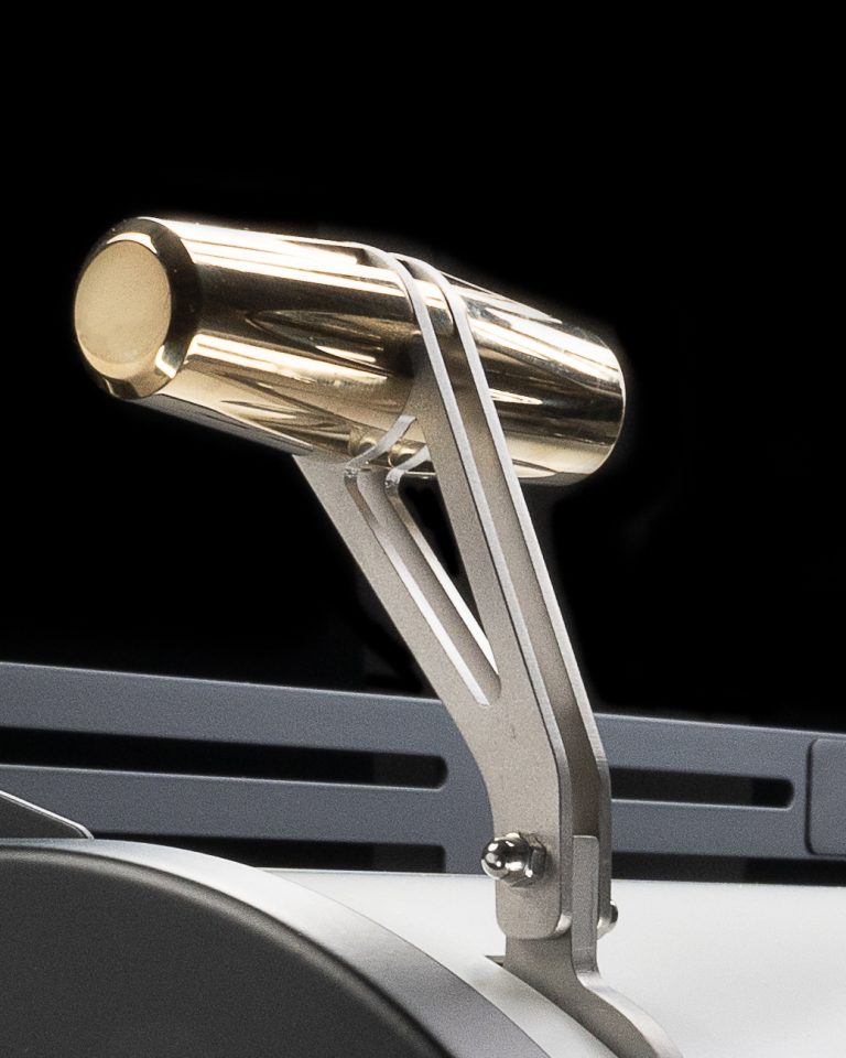 Close view of the brass cap and machined arm of a BIGFACE Leva lever