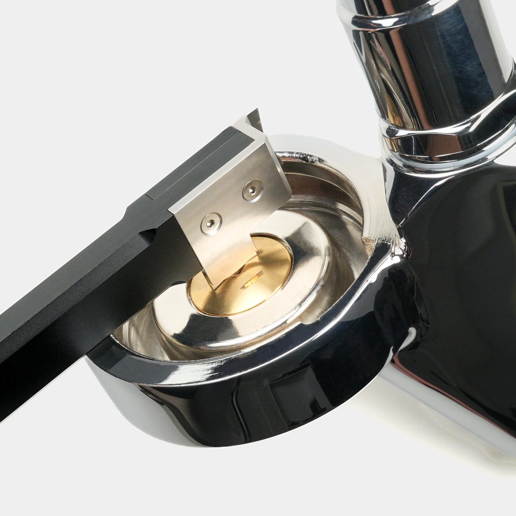 Group Head Access Tool radius tab engaging the dispersion screw inside an espresso machine group head