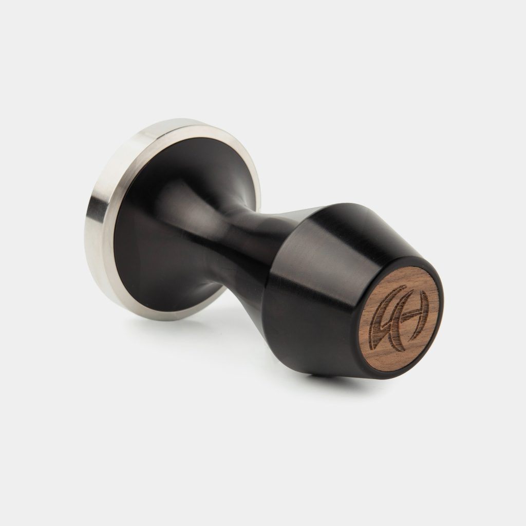 Revo B tamper with black anodised body, stainless base ring and walnut inlay cap
