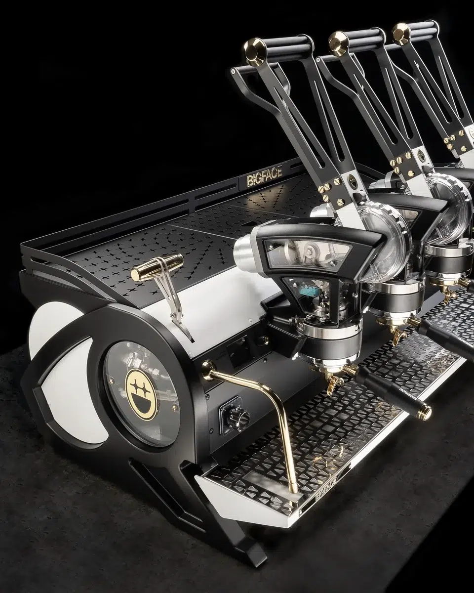 BIGFACE La Marzocco Leva three group lever espresso machine in black and cream with gold levers and brass fittings