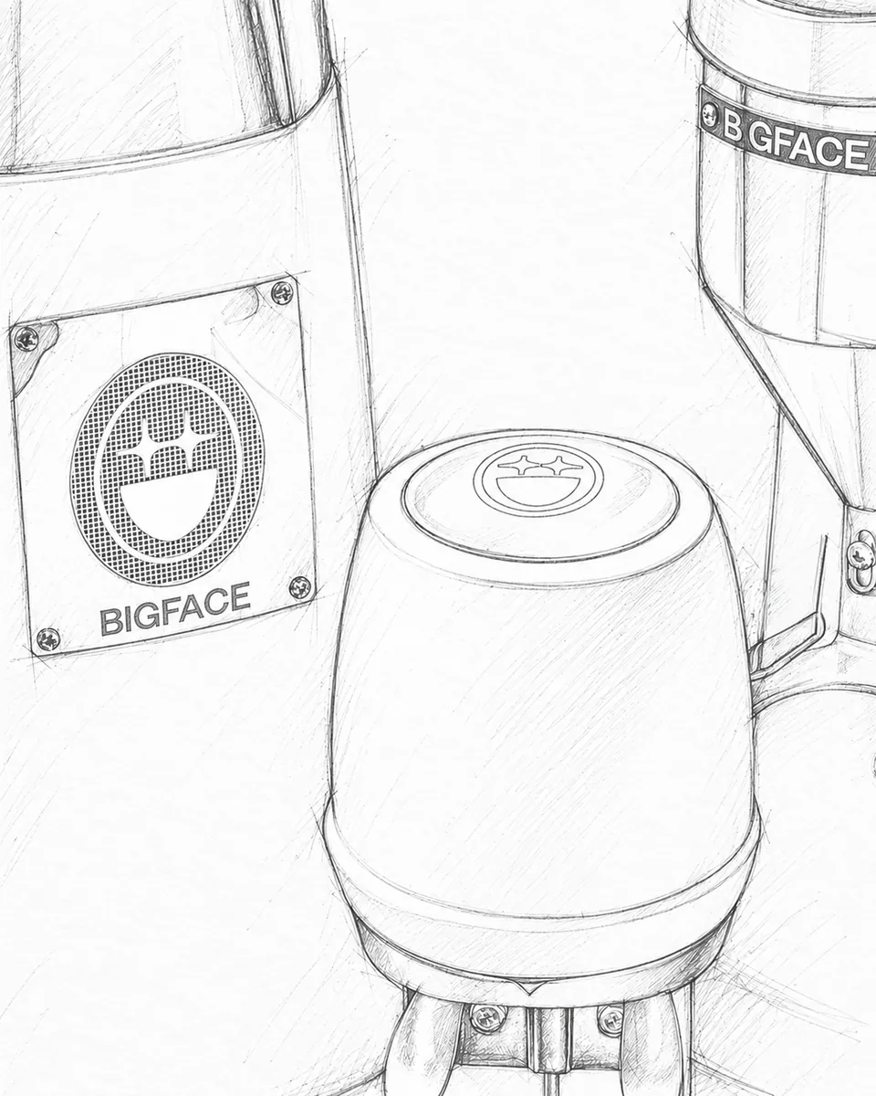 Hand-drawn pencil sketch of the BIGFACE badge plate on the La Marzocco Strada, a machined cap in front and a BIGFACE-banded grinder hopper behind